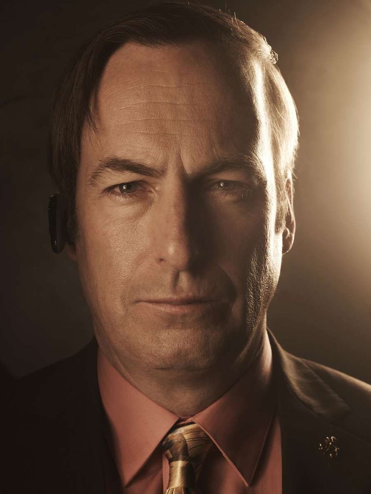 Man in a suit with a confident smirk — Saul Goodman